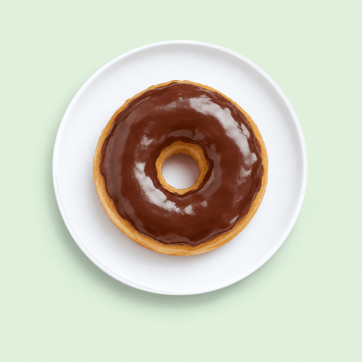 Donut covered with glossy chocolate icing