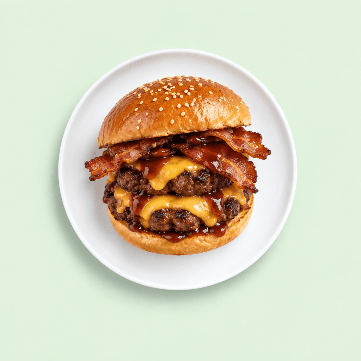 Double Angus beef burger stacked with cheese and bacon
