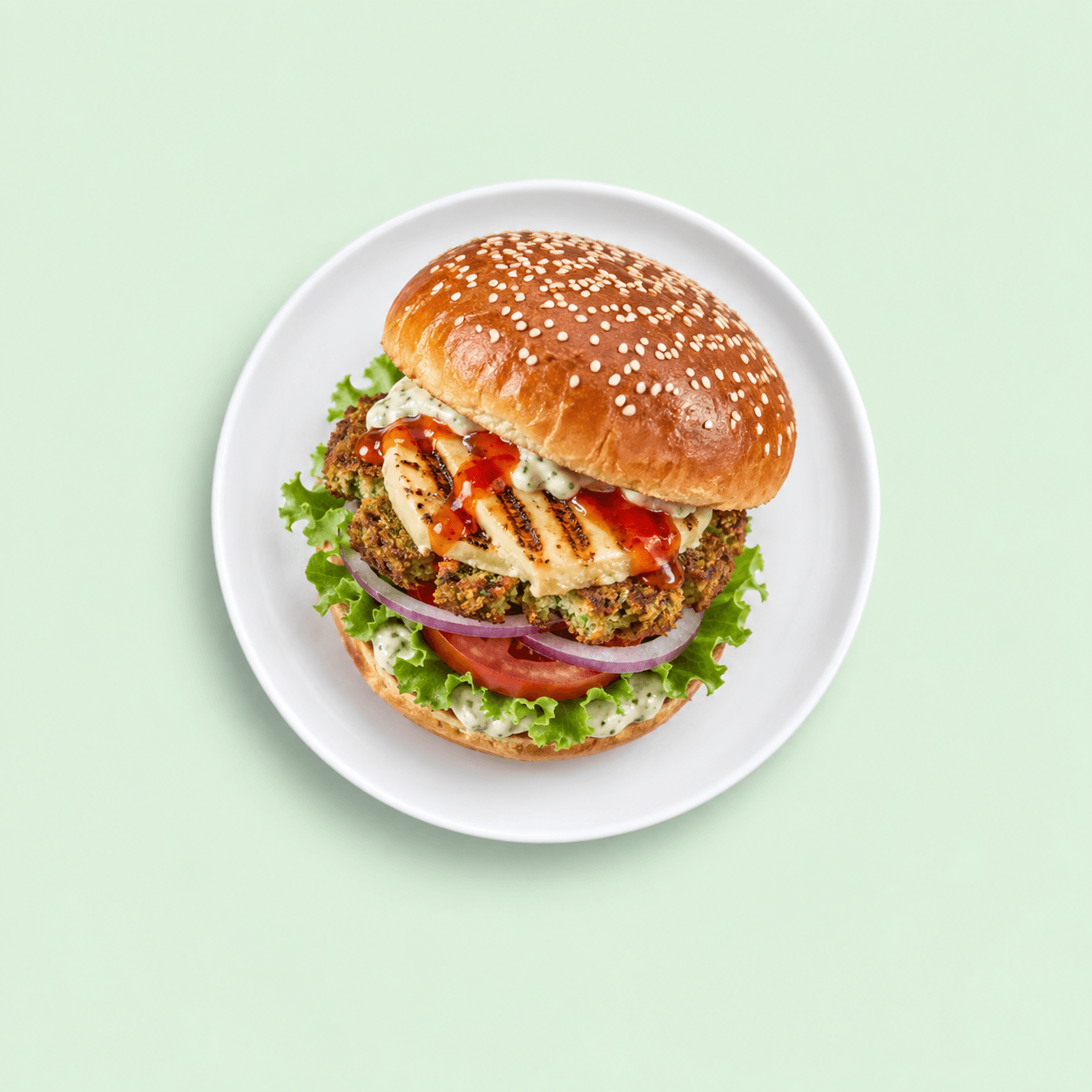 Falafel burger with grilled cheese and fresh salad